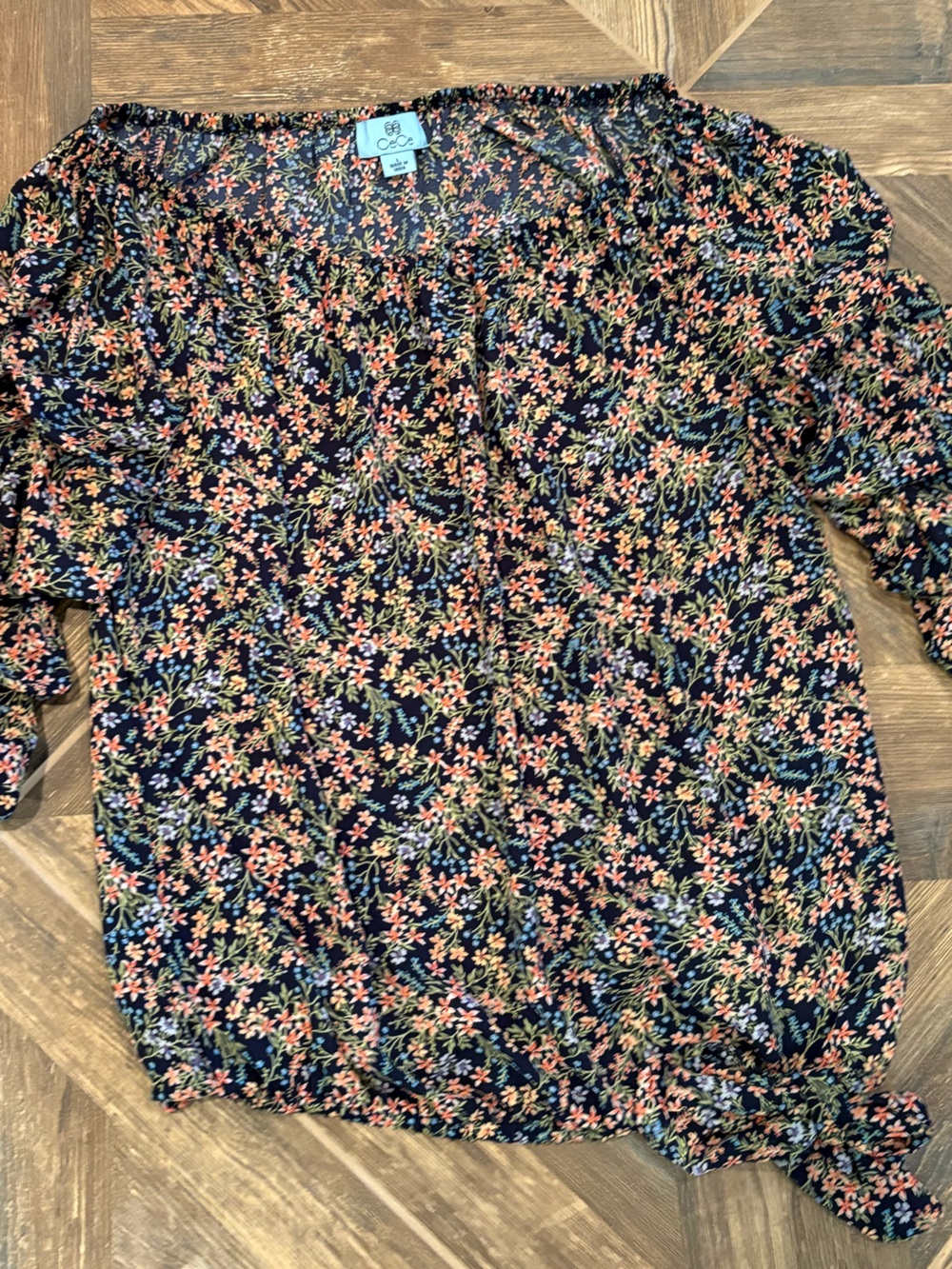 CeCe Navy Floral Peasant Blouse with bubble hem and side accent tie